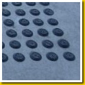 Black Stemmed PVC Dots inset in concrete panel