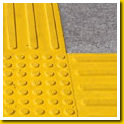 Yellow Stikcrete tactiles inset in concrete floors